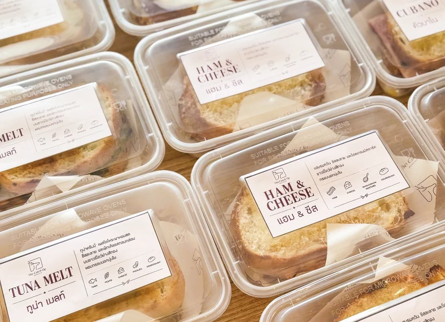 Packaged sourdough sandwiches prepared for takeaway and catering